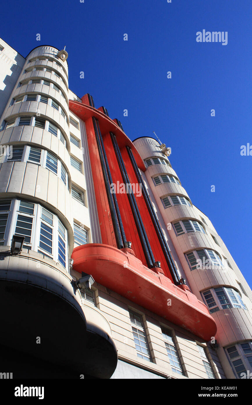 Beresford building - Sauchiehall street Glasgow - Glasgow Art Deco architecture. Red and white flats built in the 1930's with blue sky background Stock Photo