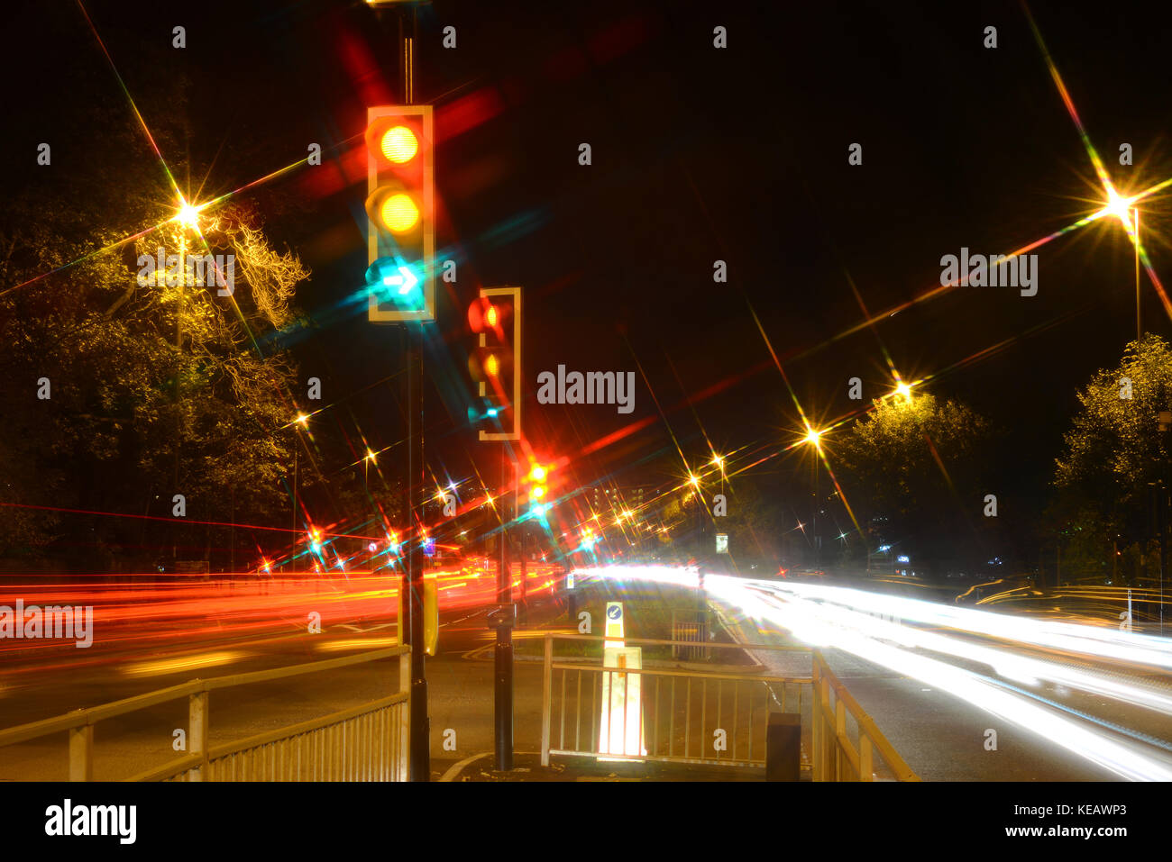time exposure red amber and green traffic light at night leeds united  kingdom Stock Photo - Alamy