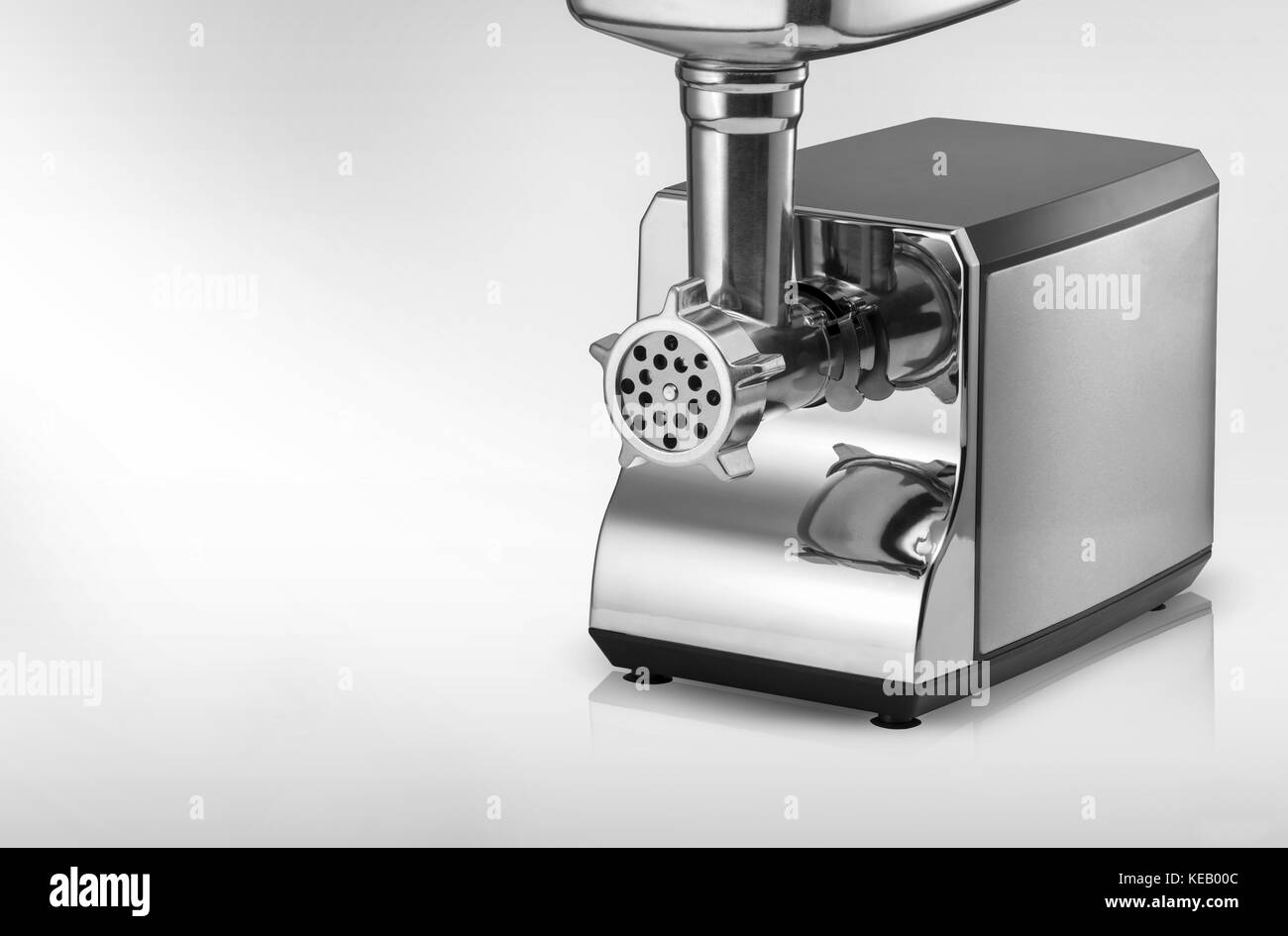 modern electric meat grinder on a light background Stock Photo Alamy