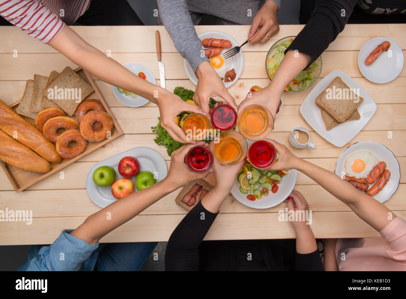 Enjoying dinner with friends. Top view of group of people having dinner