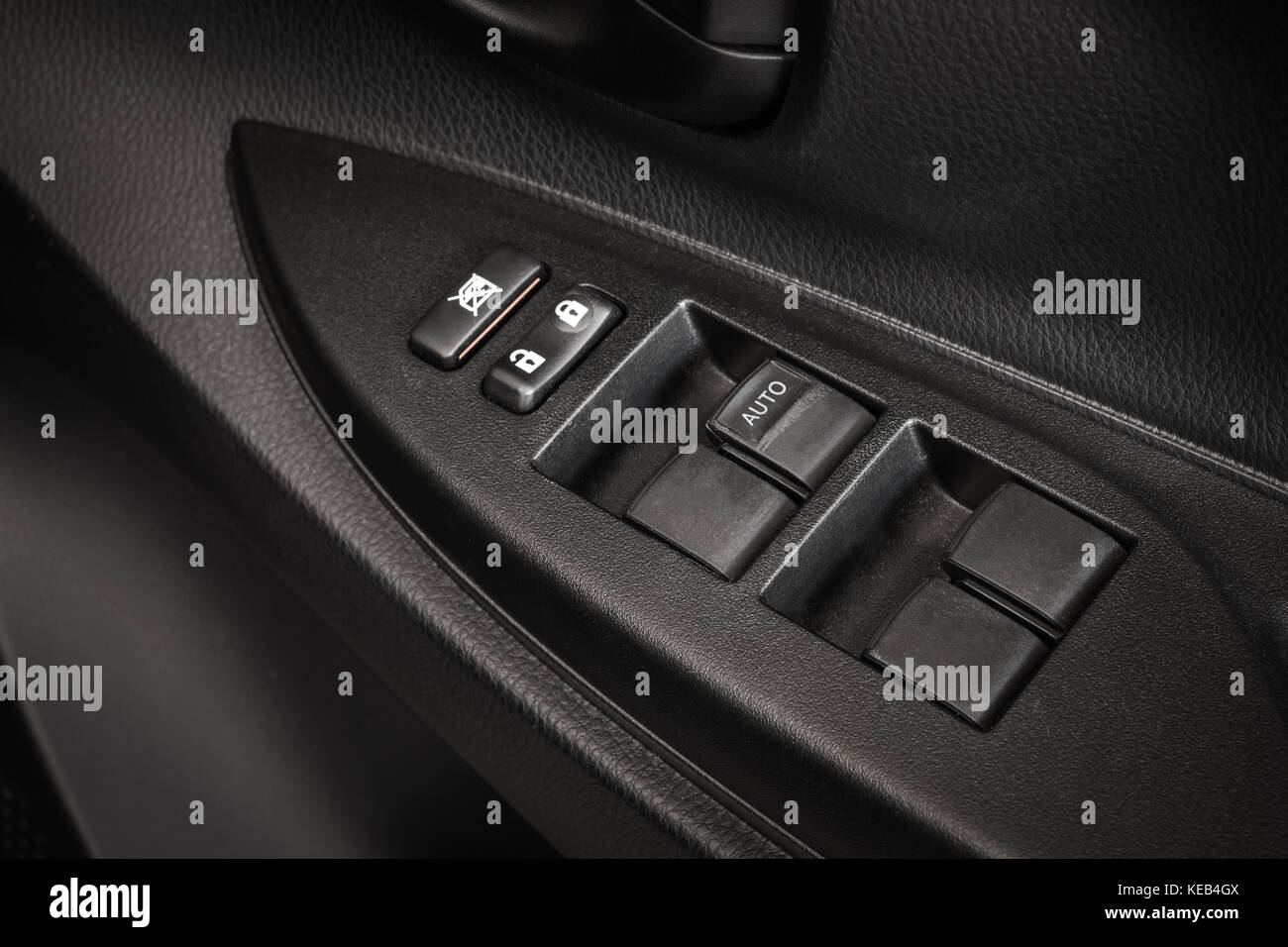 Car Door Lock Button Closeup. Electric Locking Button in Modern Car Stock Photo
