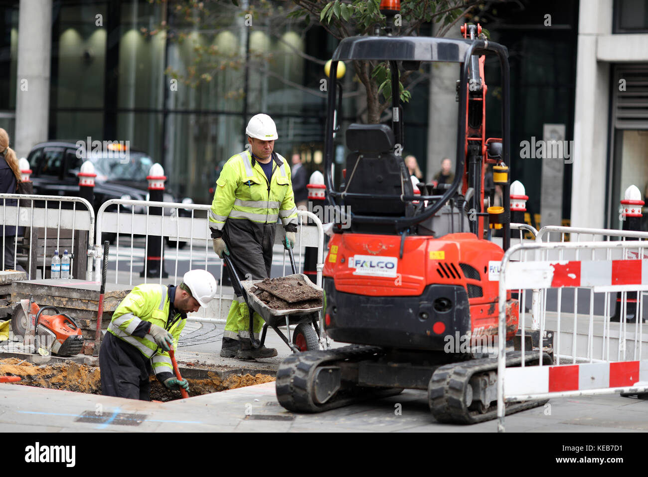 workers digging up road for electricity Stock Photo Alamy