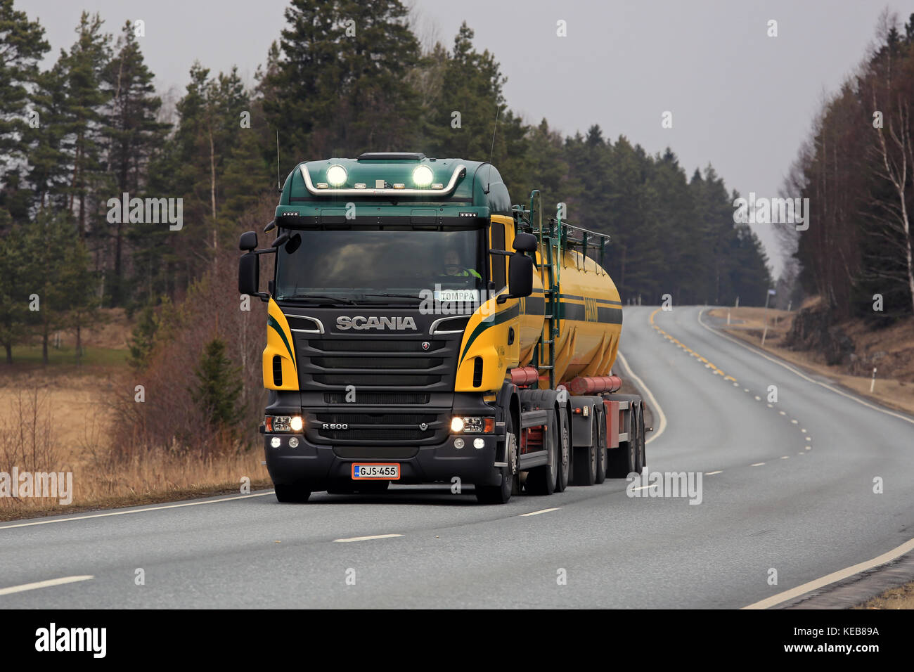 SALO, FINLAND - MARCH 28, 2016: Colorful Scania R500 tank truck on the road in South of Finland. The driver flashes the high beams briefly. Stock Photo