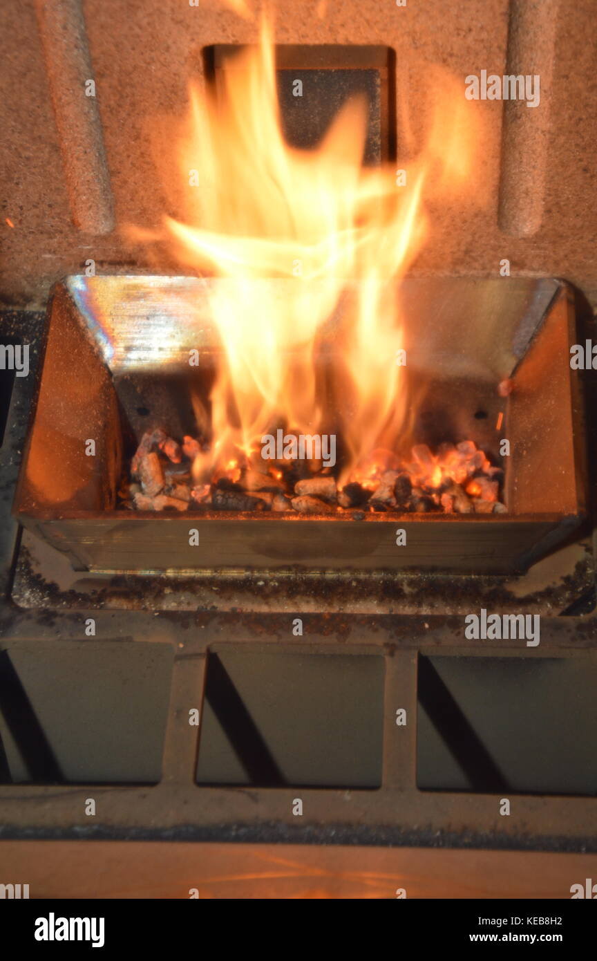 Wood pellets in the fire Stock Photo