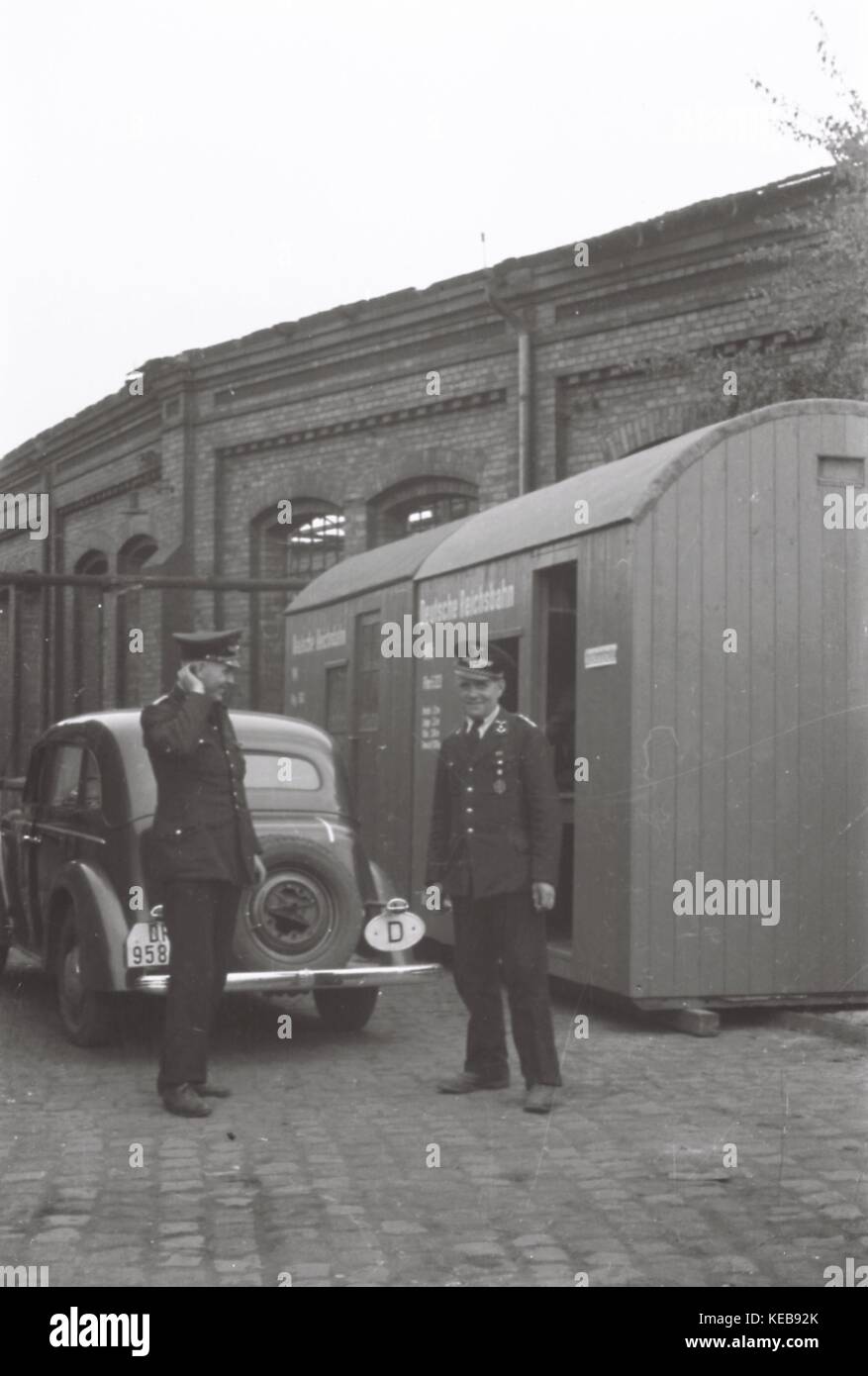 May 1943, Frankfurt am Main: On the photo are the both leading officers of the 4. Transport Battallion of the Deutsche Reichsbahn, located in Frankfurt am Main in the Reichsbahndirektion Frankfurt am Main, before their office replacement, after the old offices are bombed from allied aircrafts. Stock Photo