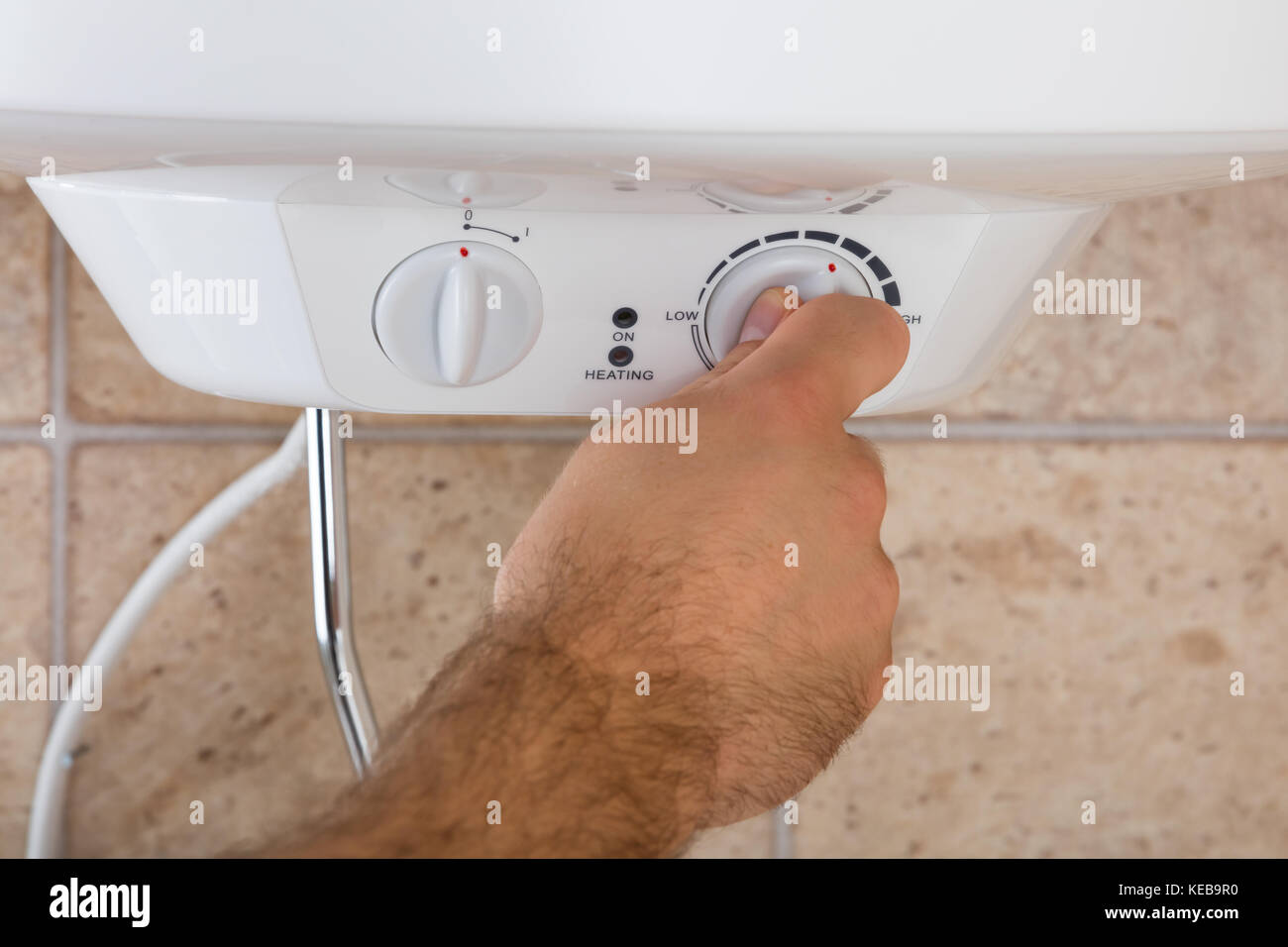 Close-up Of Man's Hands Turning The Knob Of Electric Boiler Stock Photo ...