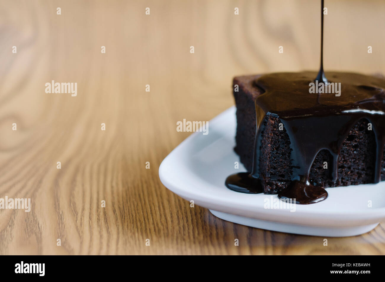 chocolate sponge cake poured with melting chocolate Stock Photo