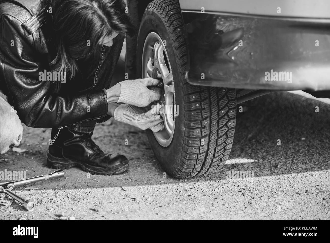 Change a flat car tire on road with Tire maintenance, damaged car tyre