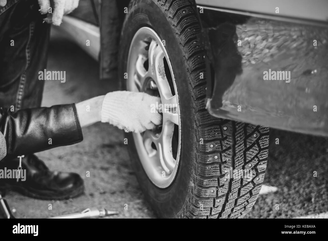 Change a flat car tire on road with Tire maintenance, damaged car tyre