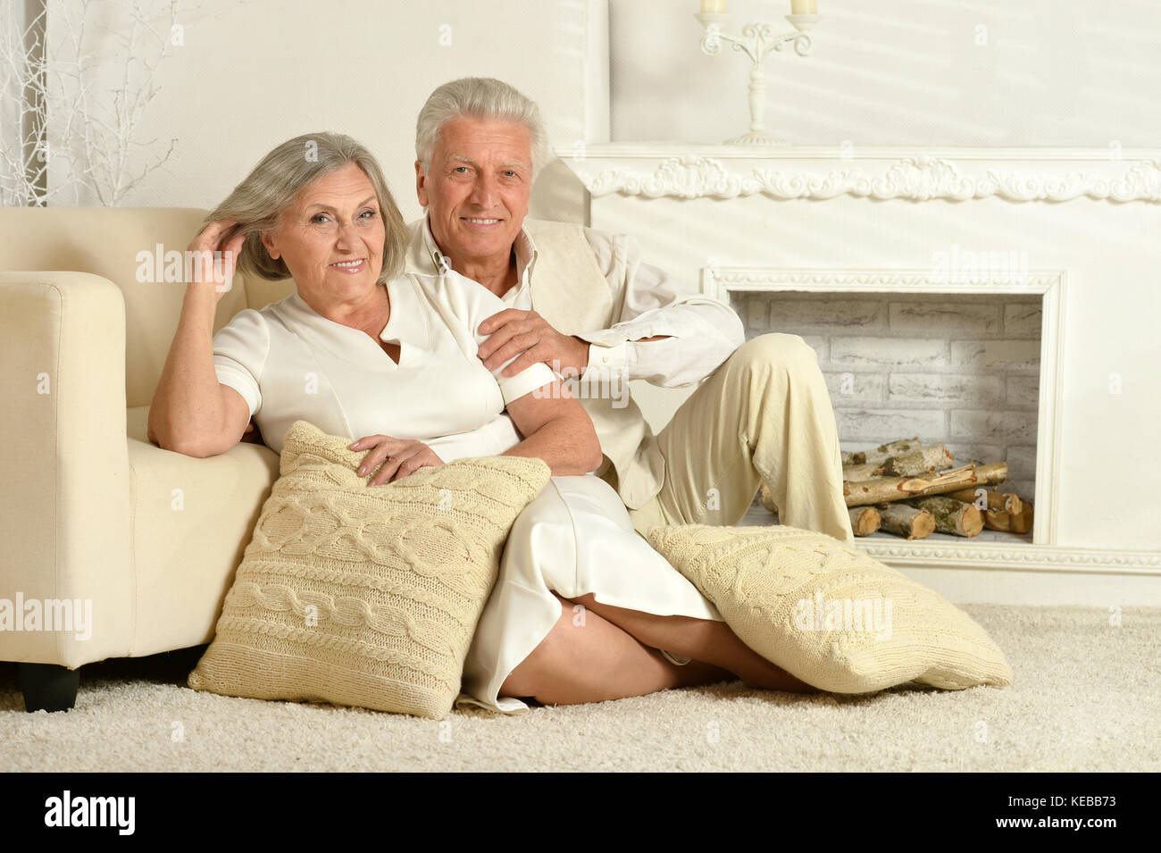 Elderly people sitting at home Stock Photo