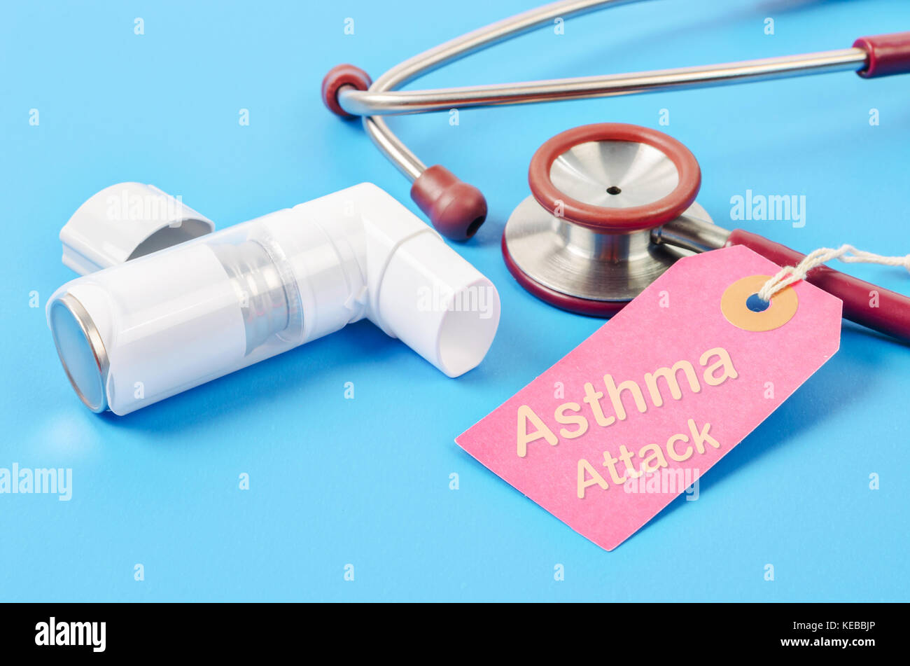 Asthma attack tag with asthma inhaler with stethoscope medical on blue
