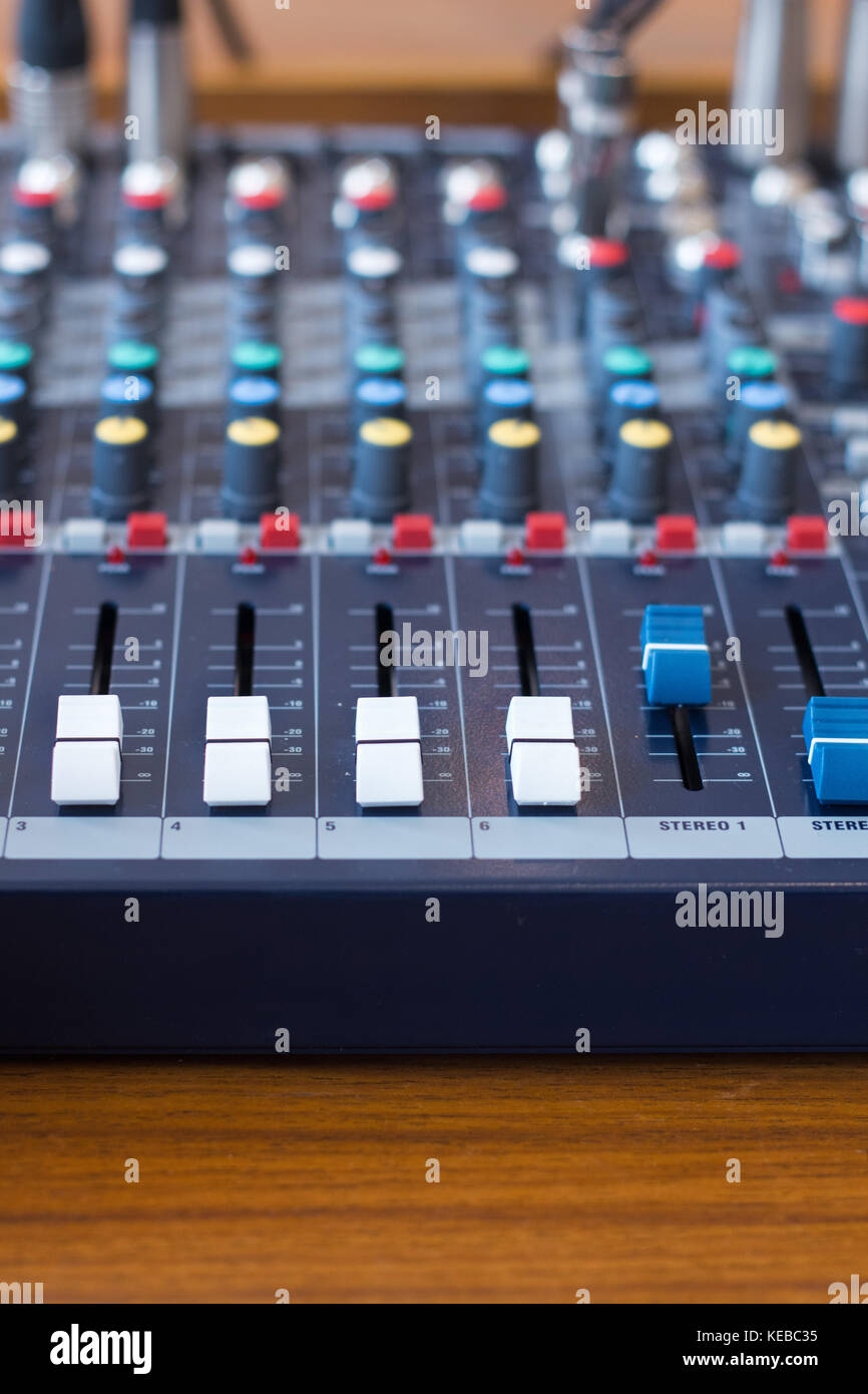 Closeup mixer in recording room. Closeup button to increase or decrease sound. Stock Photo