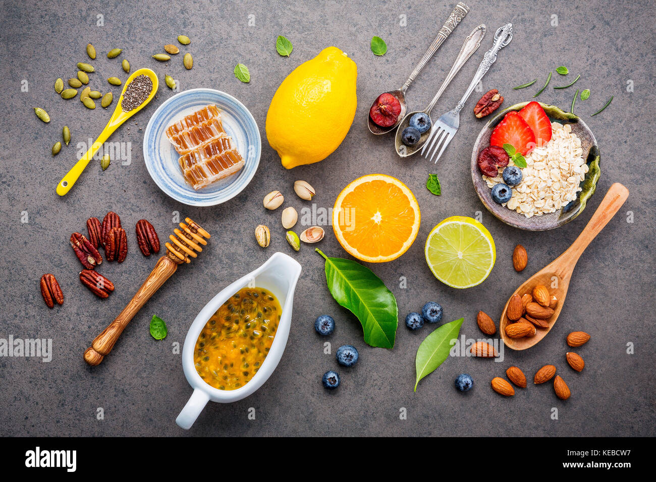 Ingredients for the healthy foods background Mixed nuts, honey, berries