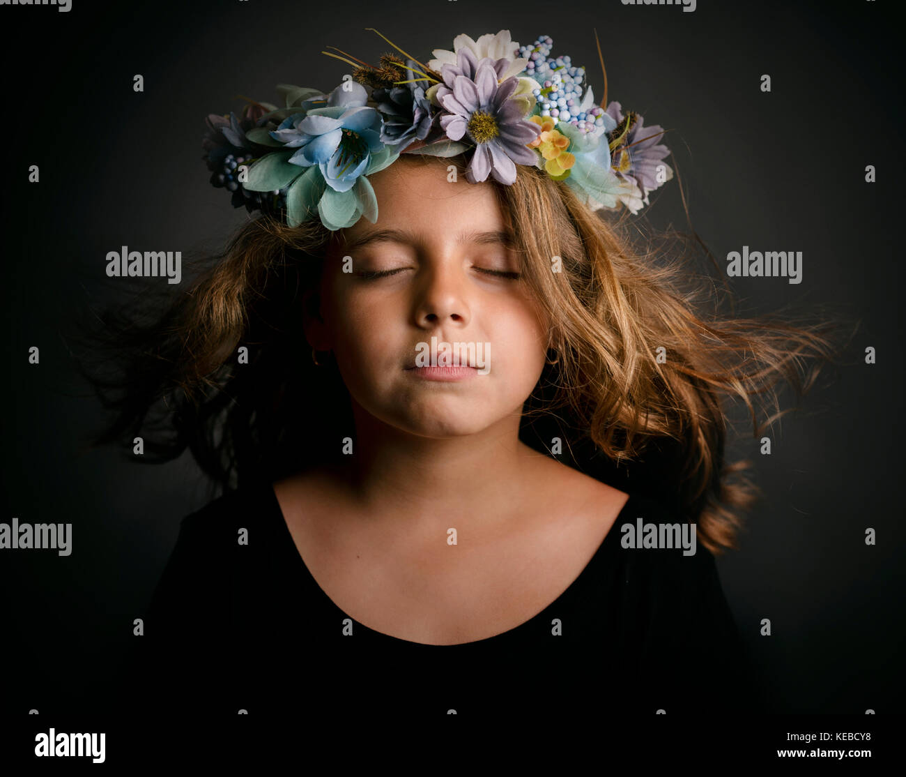 Cute little girl with flower wreath Stock Photo - Alamy