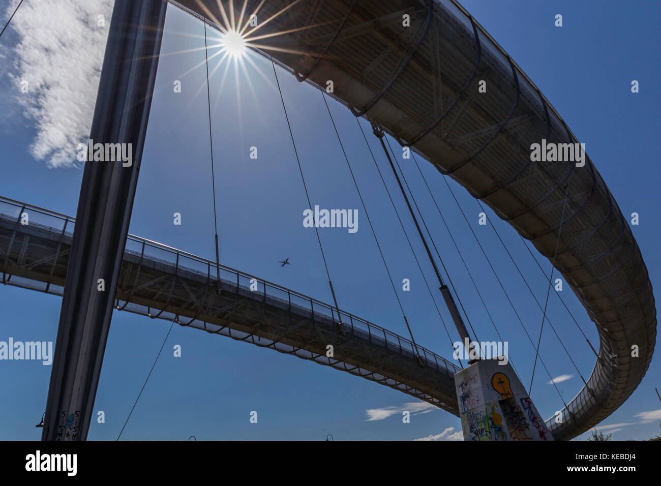 Ponte del Mare - suspended bridge at Pescara, Italy. Plane flying in background Stock Photo