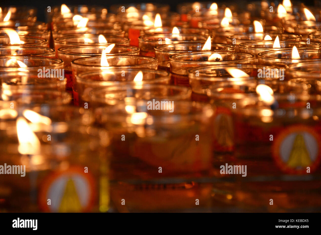 Burning candles in a temple for worship Stock Photo Alamy