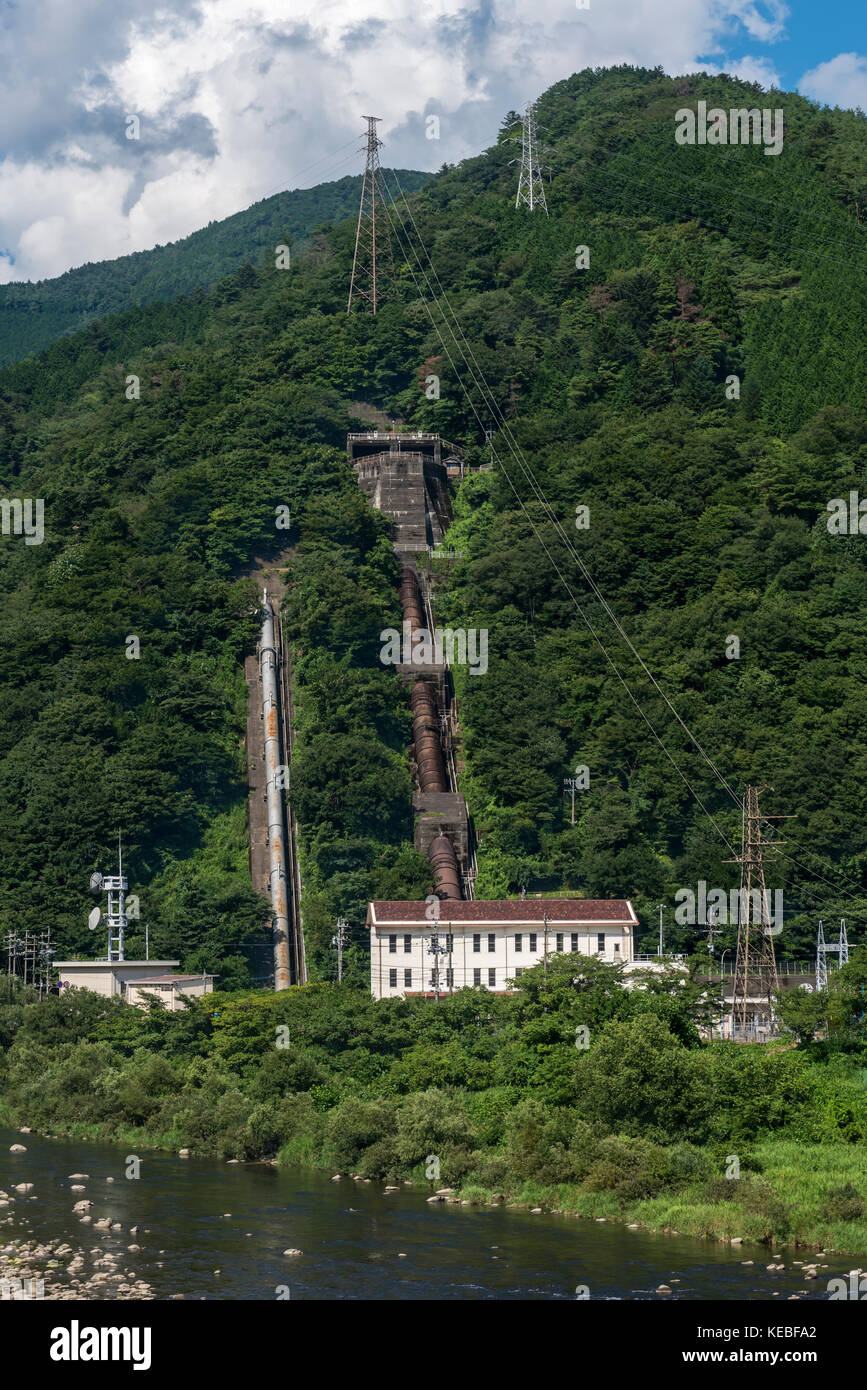 A hydroelectric power station on the side of a steep mountain in the Japanese Alps region of Japan Stock Photo