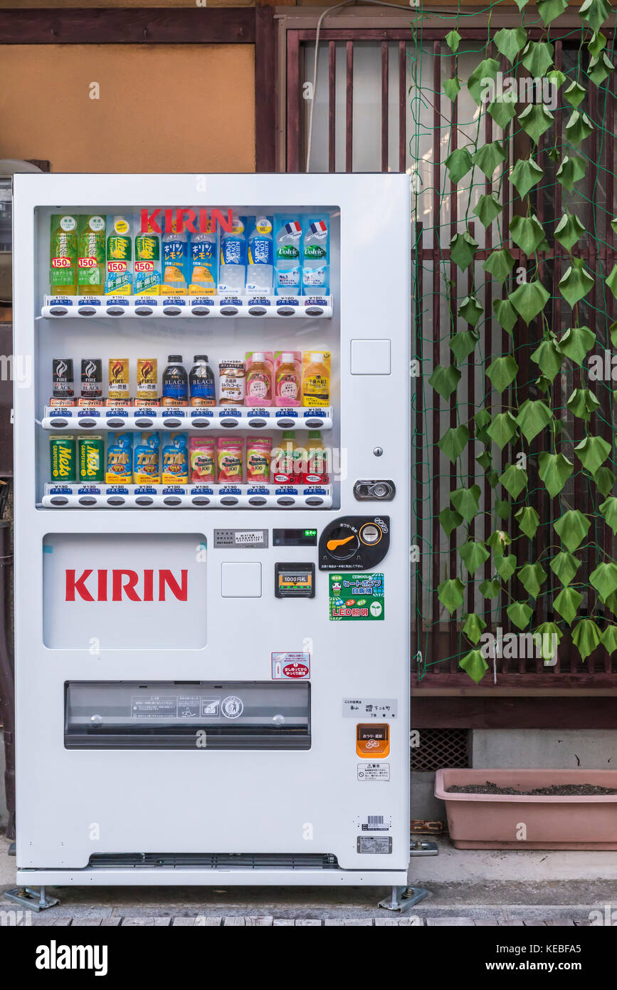 Kirin vending machine full of drinks bottles in a Japan outside a building in an urban environment Stock Photo