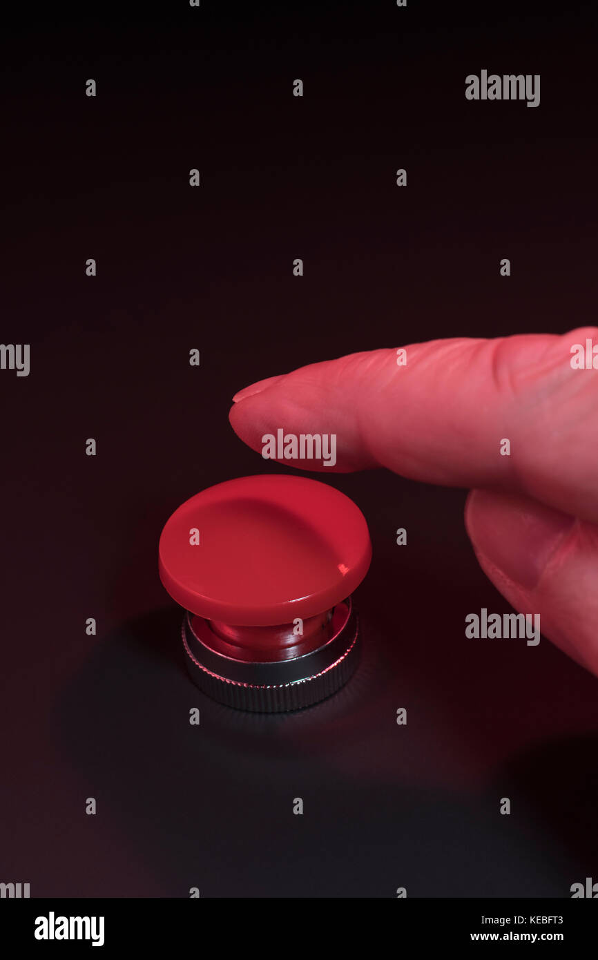 Big red button - metaphor for 'Finger on the Button'. Photographer's ...