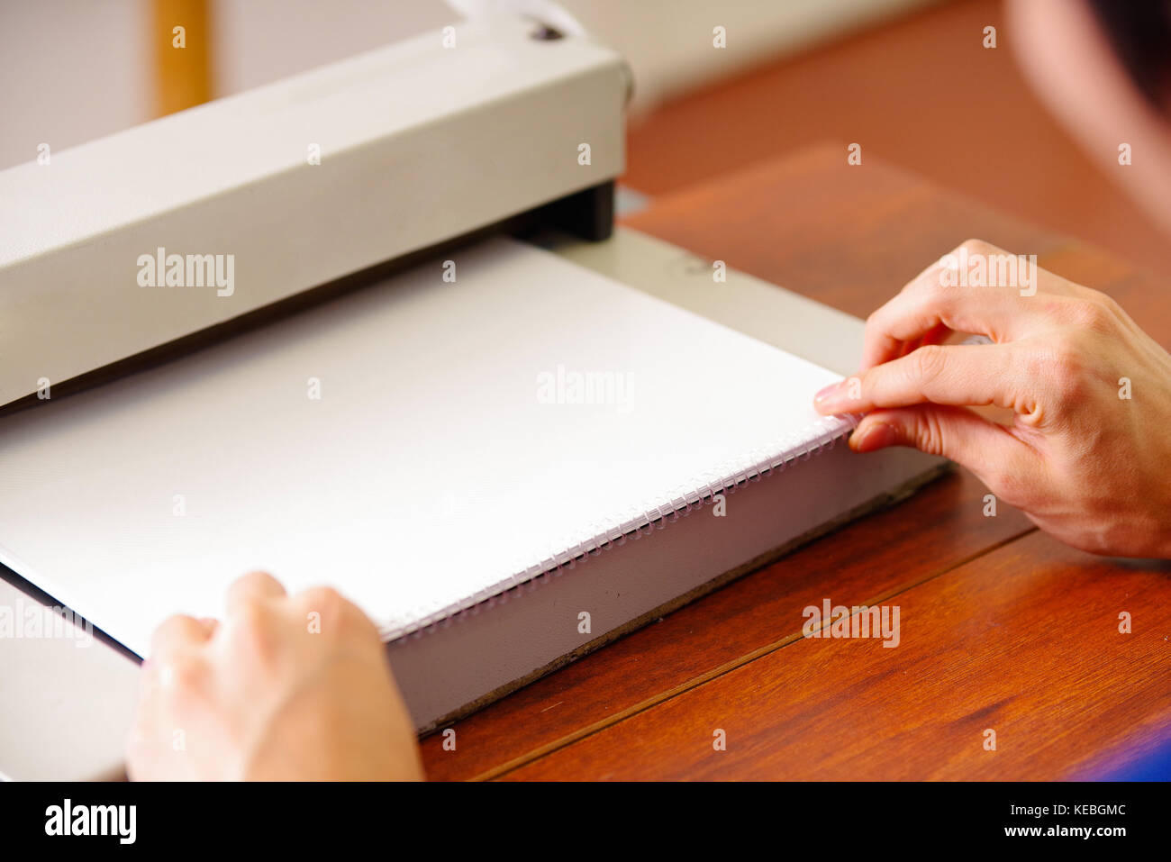 Man organizing the documents using his hands to binding documents using