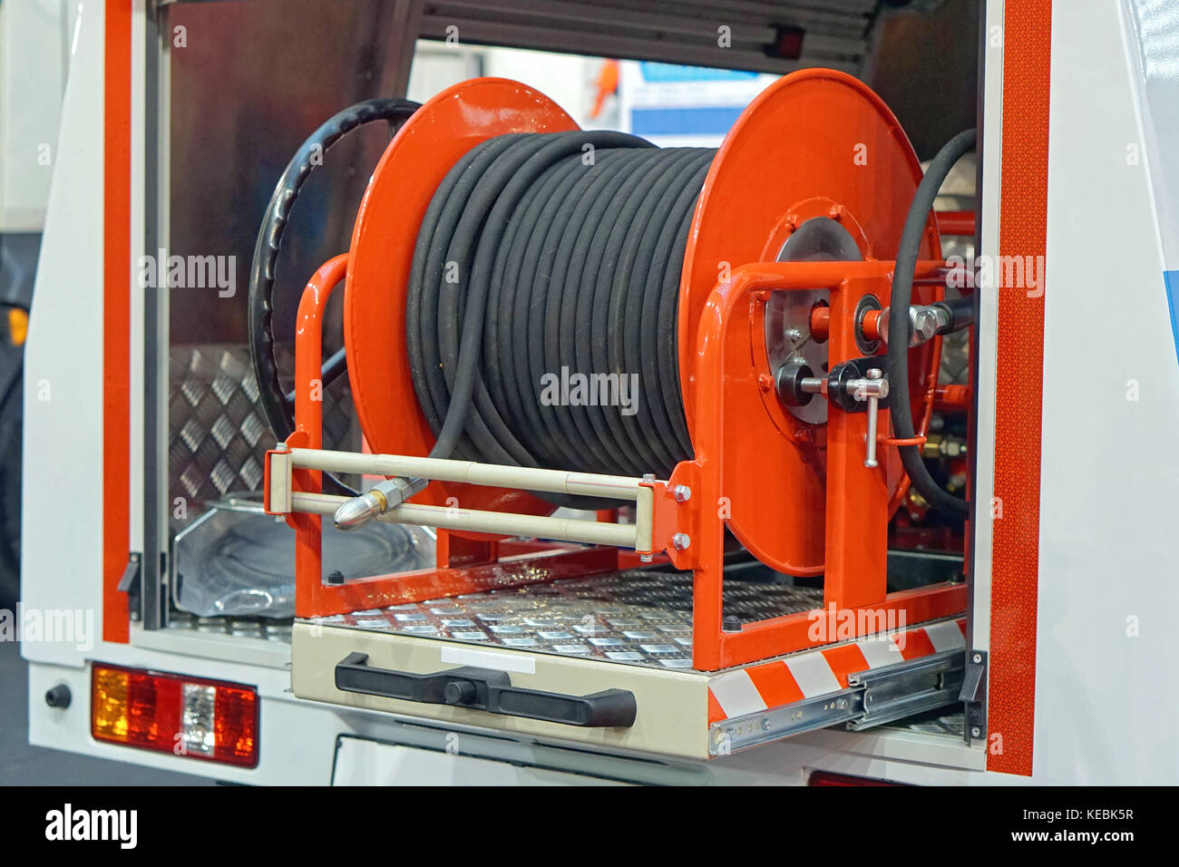 Fire hose coil at truck engine Stock Photo Alamy