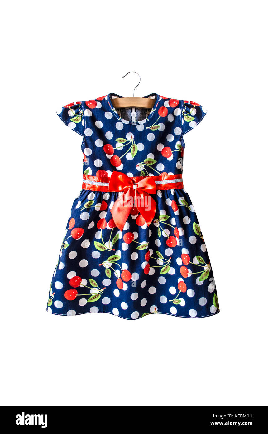Isolated baby blue summer dress with a pattern of white polka dots and