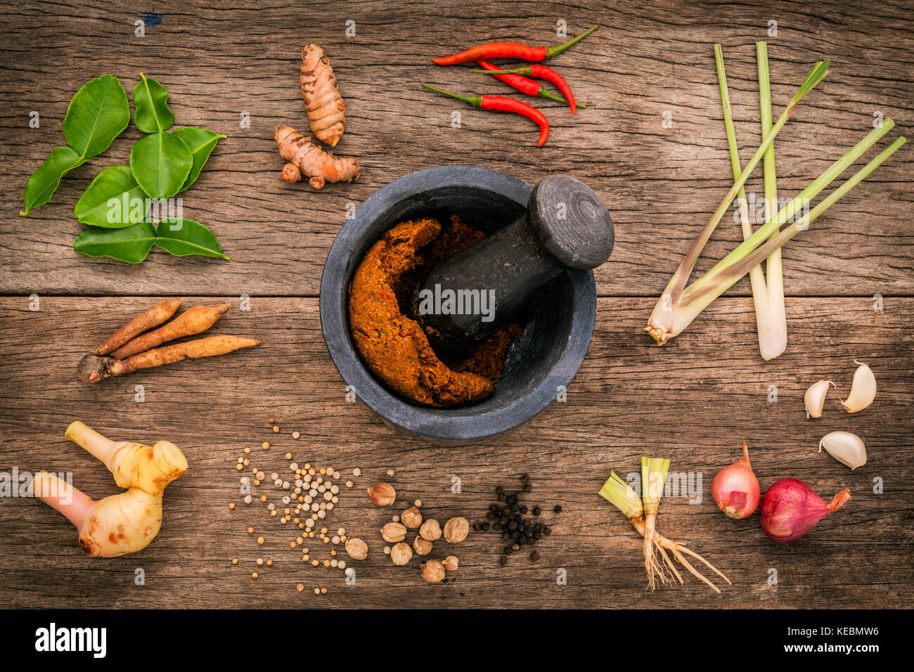 Assortment of Thai food Cooking ingredients and spice red curry paste ingredient of thai popular food on rustic wooden background. Spices ingredients  Stock Photo