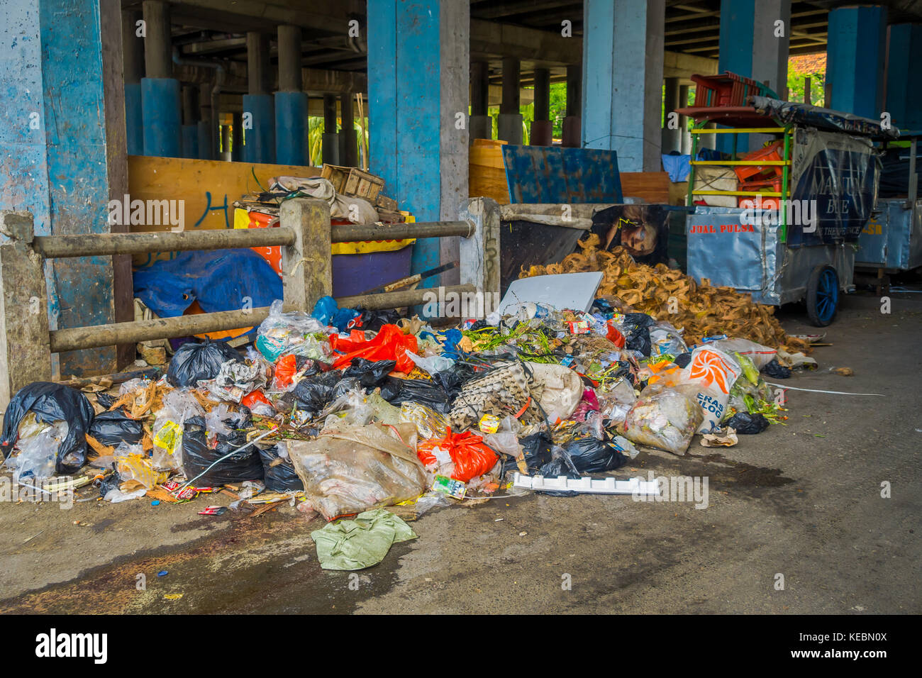 JAKARTA, INDONESIA Bags of trash and other objects scattered on street awaiting pickup Stock