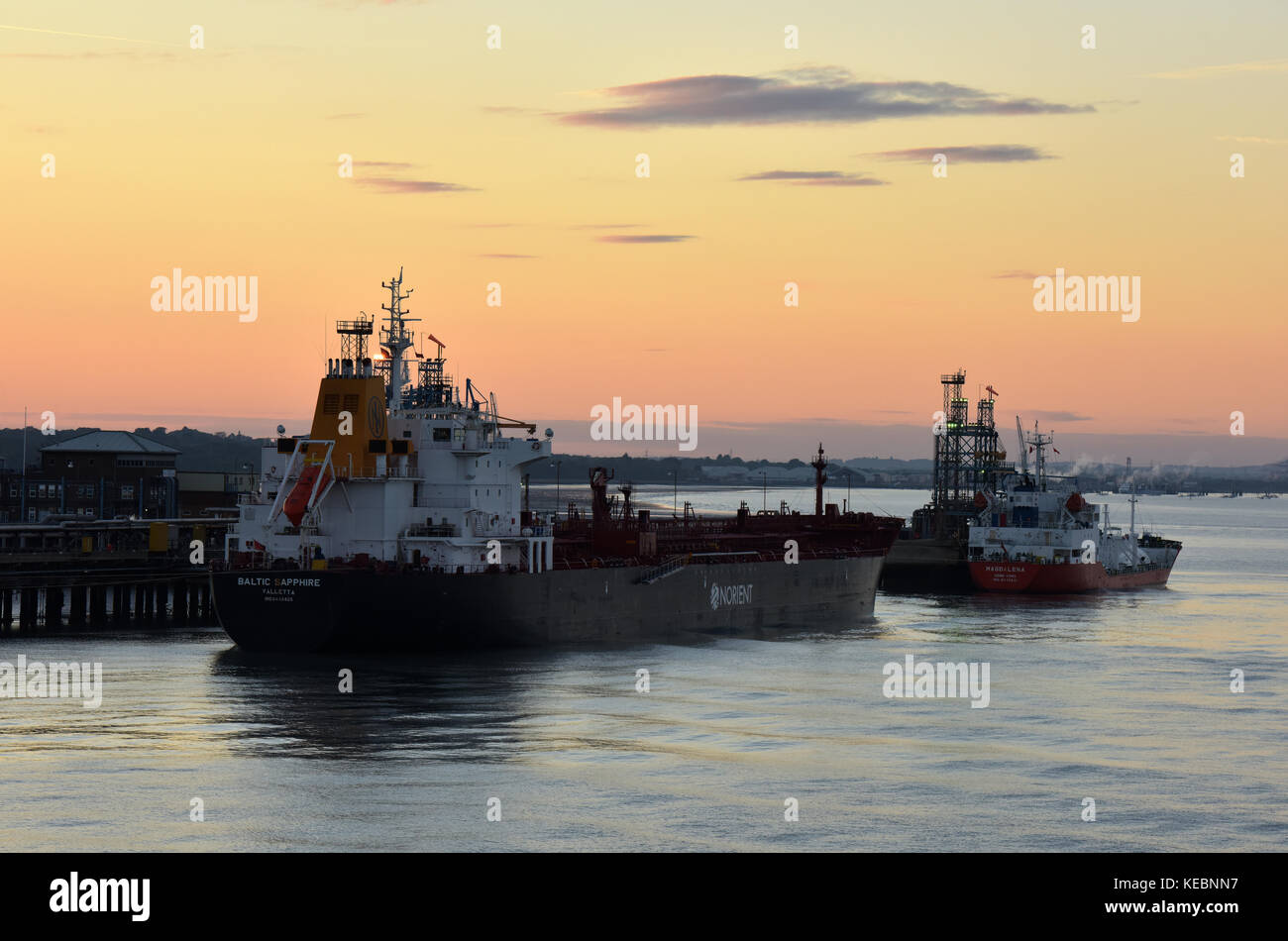 oil and gas ships and tankers alongside or docked at the exon mobil or esso oil refinery marine terminal at fawley on Southampton water or port solent. Stock Photo