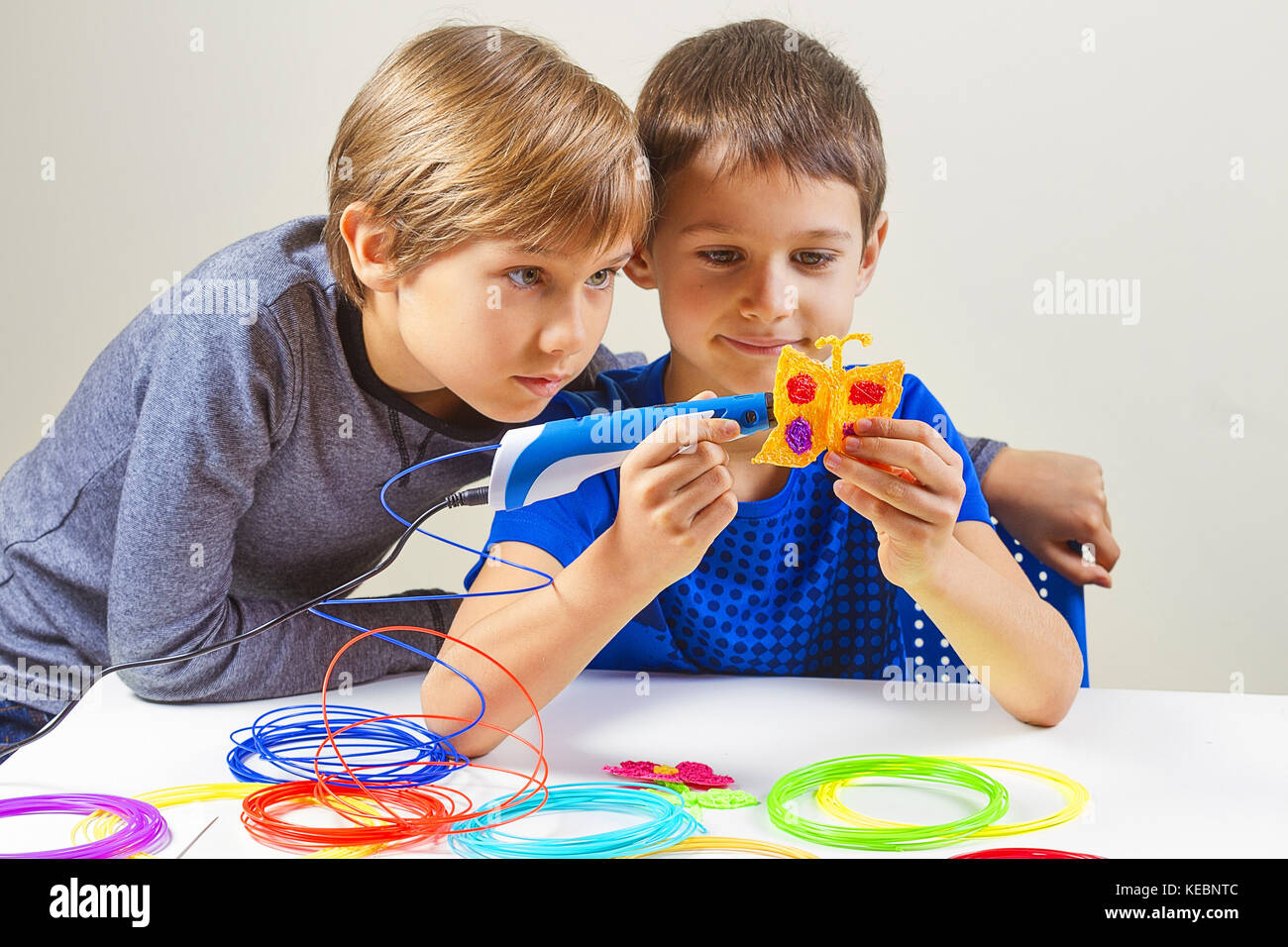 Children creating with 3d printing pen Stock Photo - Alamy