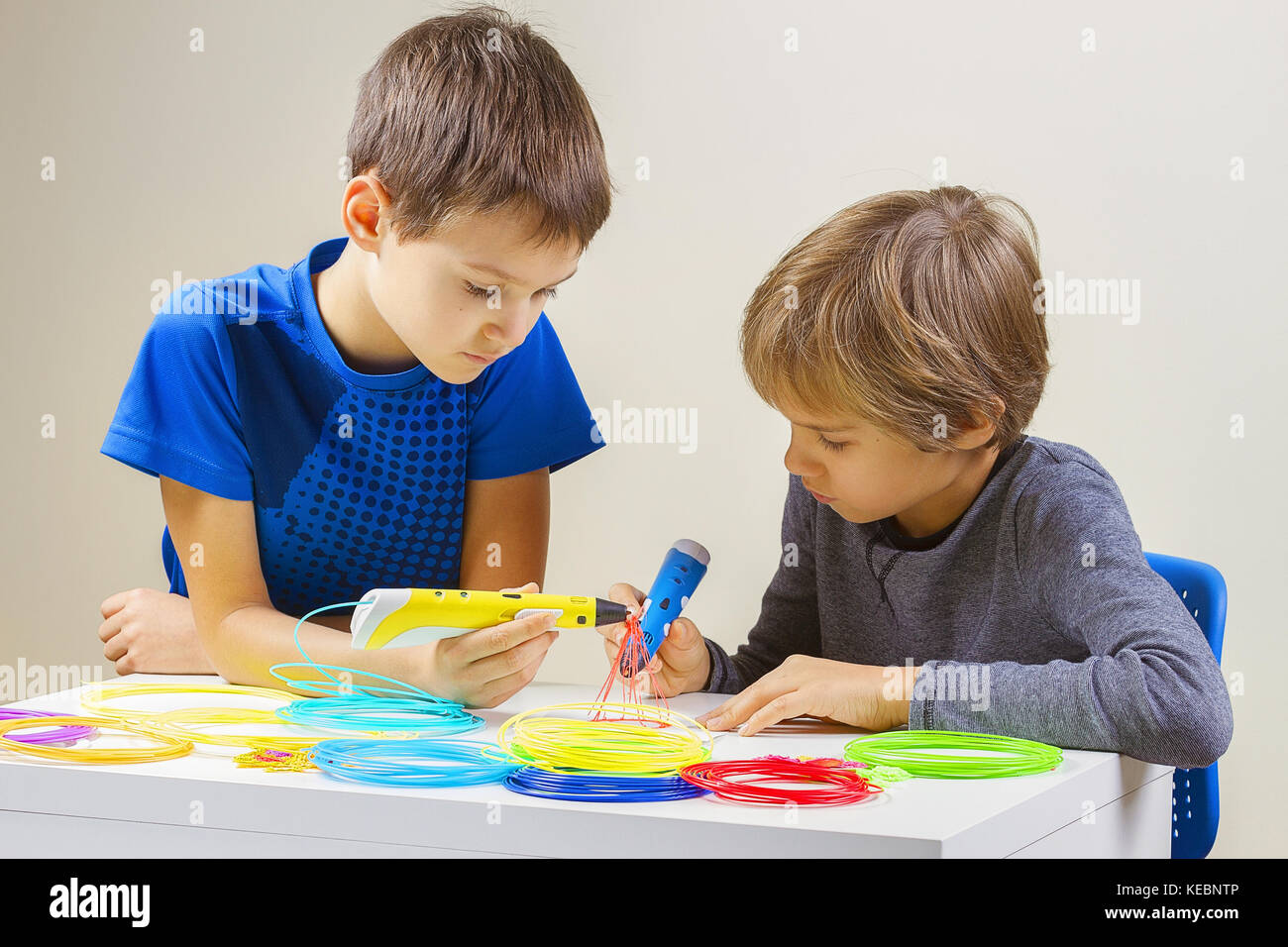 Children creating with 3d printing pen Stock Photo - Alamy