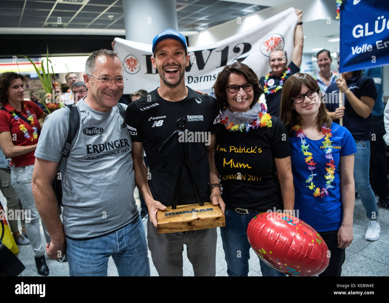Frankfurt am Main, Germany. 19th Oct, 2017. Ironman World Champion Patrick Lange is received by supporters, among them his mother Carmen, at the airport in Frankfurt am Main, Germany, 19 October 2017. Partick Lange has won the Ironman World Championships in Hawaii with a new record time. Credit: Andreas Arnold/dpa/Alamy Live News Stock Photo