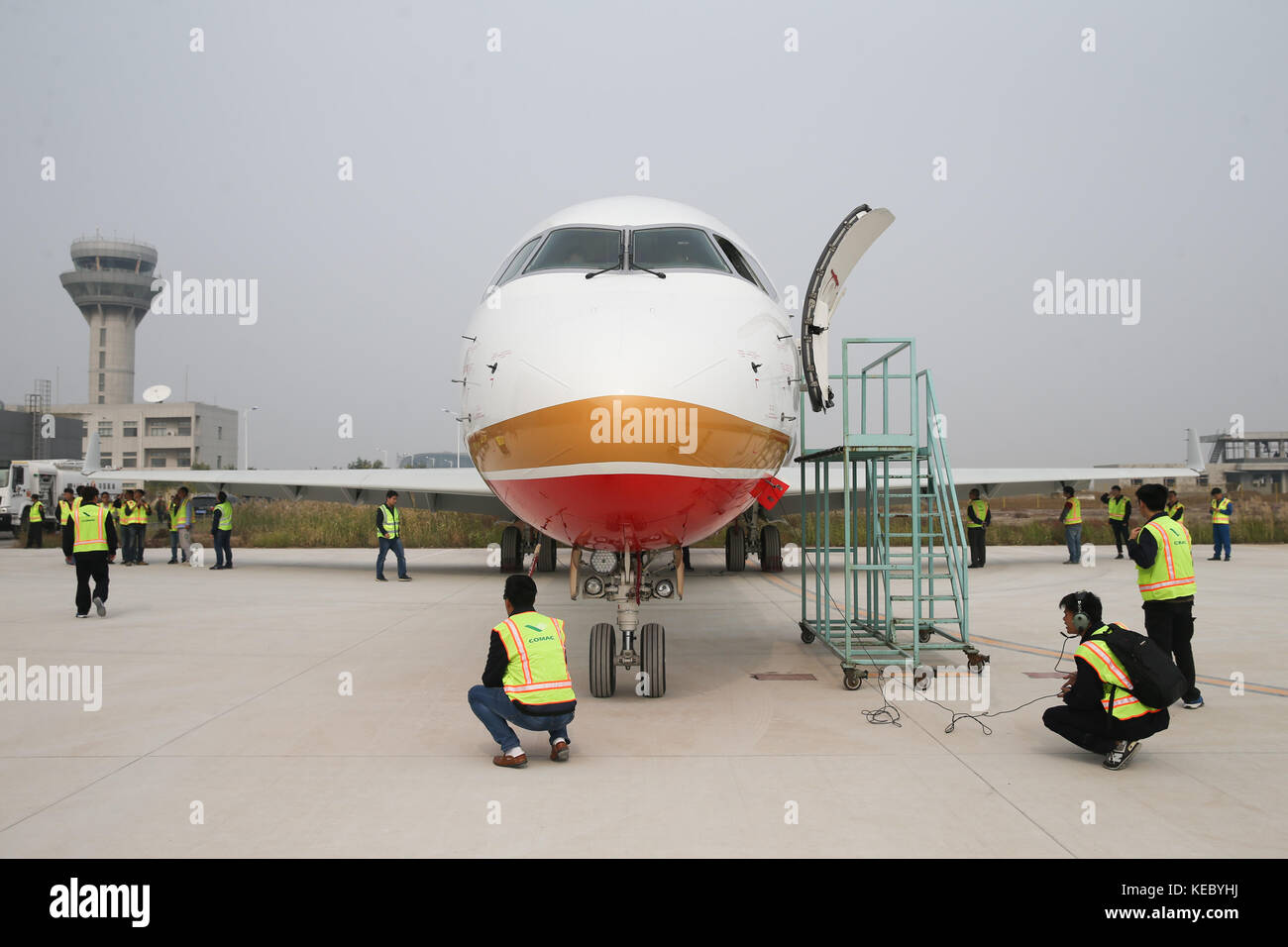Shanghai. 14th Oct, 2017. Photo taken on Oct. 14, 2017 shows ARJ21-700 jetliner at Shengli Airport in Dongying of east China's Shandong Province. China's first domestic regional jetliner ARJ21-700 was delivered Thursday after its mass production was certified in July. The ARJ21-700 jetliner has 90 economy seats and was bought by China Aerospace Leasing Company, and delivered to Chengdu Airlines. The Commercial Aircraft Corporation of China (COMAC) obtained a production license to build the airliner from the General Administration of Civil Aviation. Credit: Ding Ting/Xinhua/Alamy Live News Stock Photo