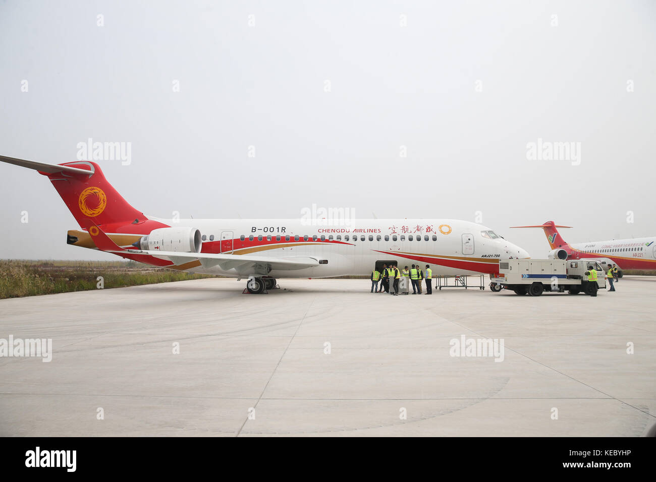 Shanghai. 14th Oct, 2017. Photo taken on Oct. 14, 2017 shows ARJ21-700 jetliner at Shengli Airport in Dongying of east China's Shandong Province. China's first domestic regional jetliner ARJ21-700 was delivered Thursday after its mass production was certified in July. The ARJ21-700 jetliner has 90 economy seats and was bought by China Aerospace Leasing Company, and delivered to Chengdu Airlines. The Commercial Aircraft Corporation of China (COMAC) obtained a production license to build the airliner from the General Administration of Civil Aviation. Credit: Ding Ting/Xinhua/Alamy Live News Stock Photo