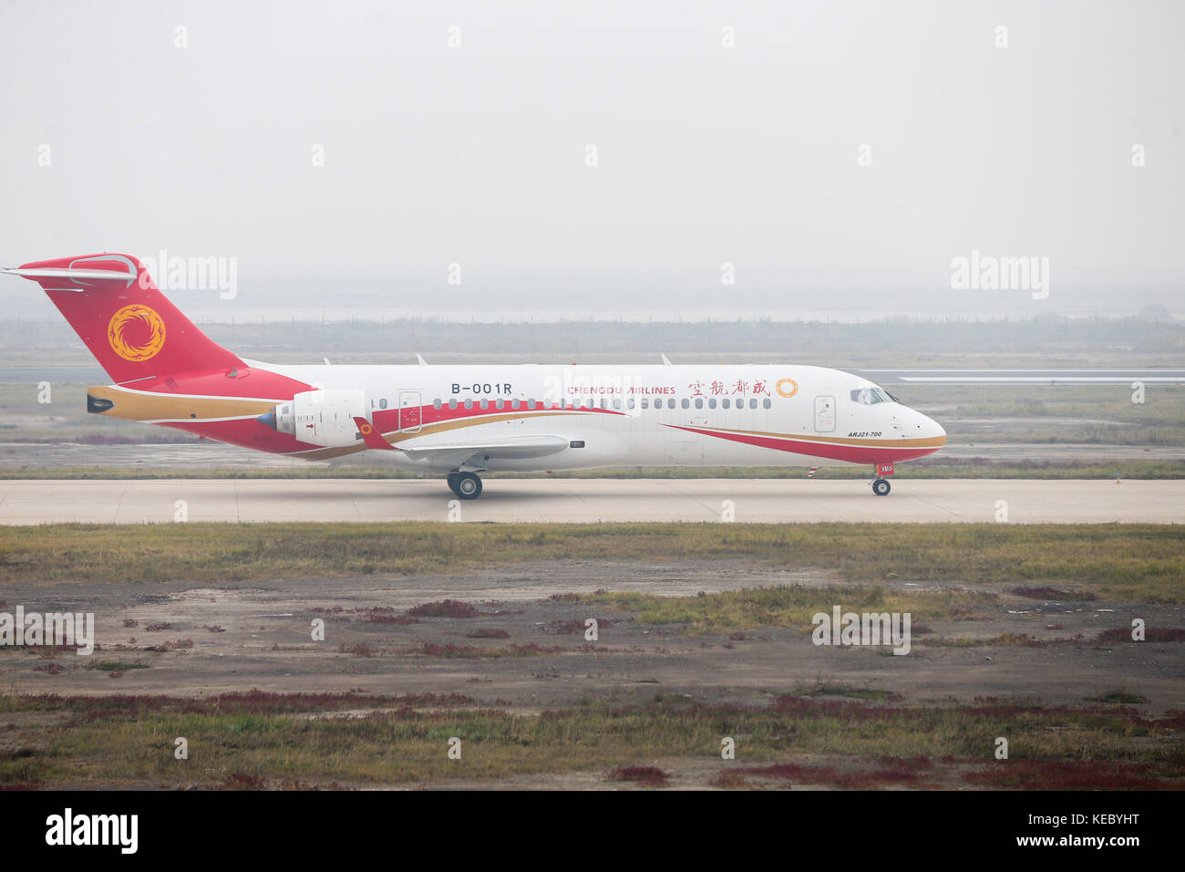 (171019) -- SHANGHAI, Oct. 19, 2017 (Xinhua) -- Photo taken on Oct. 14, 2017 shows ARJ21-700 jetliner taxiing down a runway at Shengli Airport in Dongying of east China's Shandong Province. China's first domestic regional jetliner ARJ21-700 was delivered Thursday after its mass production was certified in July. The ARJ21-700 jetliner has 90 economy seats and was bought by China Aerospace Leasing Company, and delivered to Chengdu Airlines. The Commercial Aircraft Corporation of China (COMAC) obtained a production license to build the airliner from the General Administration of Civil Aviation. ( Stock Photo