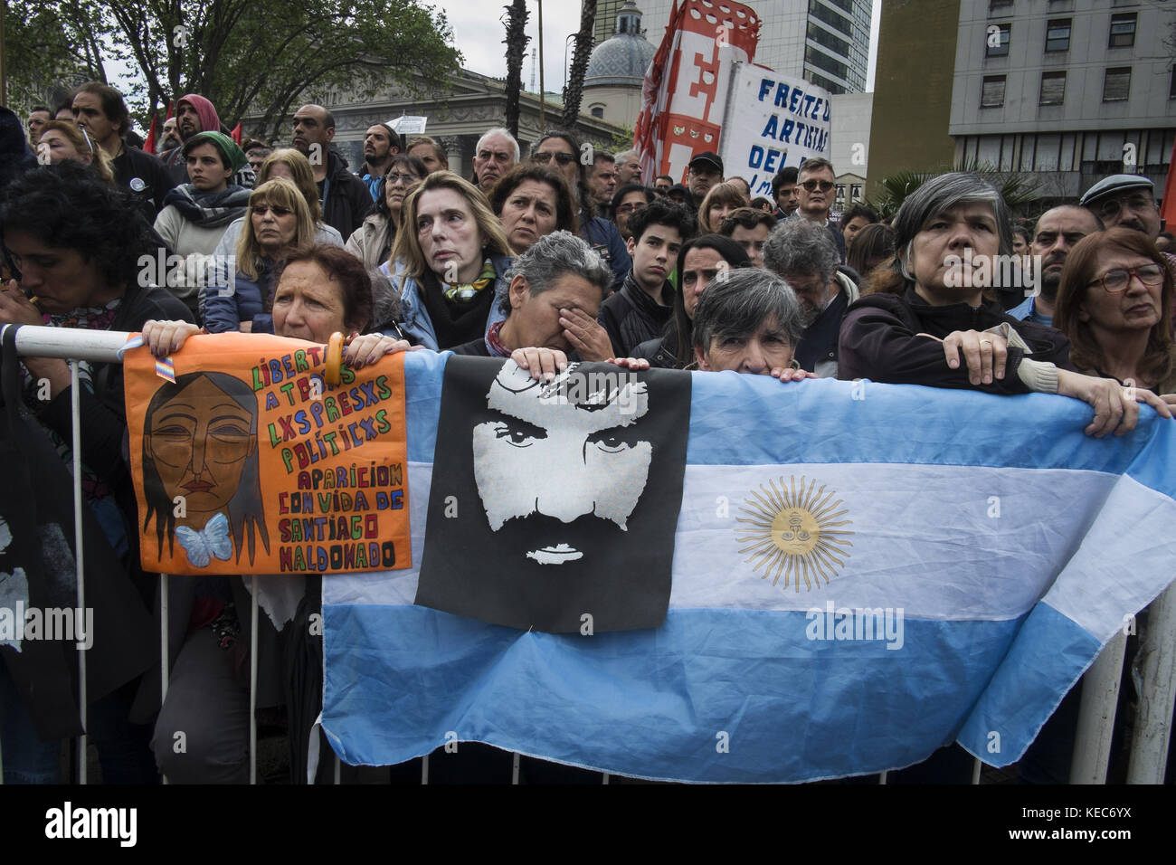 Federal Capital, Buenos Aires, Argentina. 16th Sep, 2017. Demonstrators are seen gathering to protest against the disappearance of Santiago Maldonado since 1 August 2017 while holding an Argentina flag and a photo of Santiago Maldonado.Despite the rain, thousands of protesters gathered on Sunday in Plaza de Mayo hosted by the relatives and friends of Santiago Maldonado two months after his disappearance, after he was reportedly surrendering to Argentinian police guards during a raid on a camp of Mapuche protesters in Patagonia, south of Argentina. Various protests were seen in several o Stock Photo