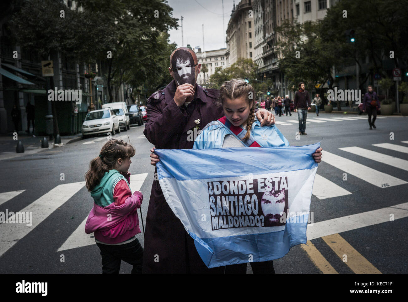 Federal Capital, Buenos Aires, Argentina. 30th Sep, 2017. Demonstrators are seen gathering to protest against the disappearance of Santiago Maldonado since 1 August 2017 while holding an Argentina flag and a photo of Santiago Maldonado.Despite the rain, thousands of protesters gathered on Sunday in Plaza de Mayo hosted by the relatives and friends of Santiago Maldonado two months after his disappearance, after he was reportedly surrendering to Argentinian police guards during a raid on a camp of Mapuche protesters in Patagonia, south of Argentina. Various protests were seen in several o Stock Photo