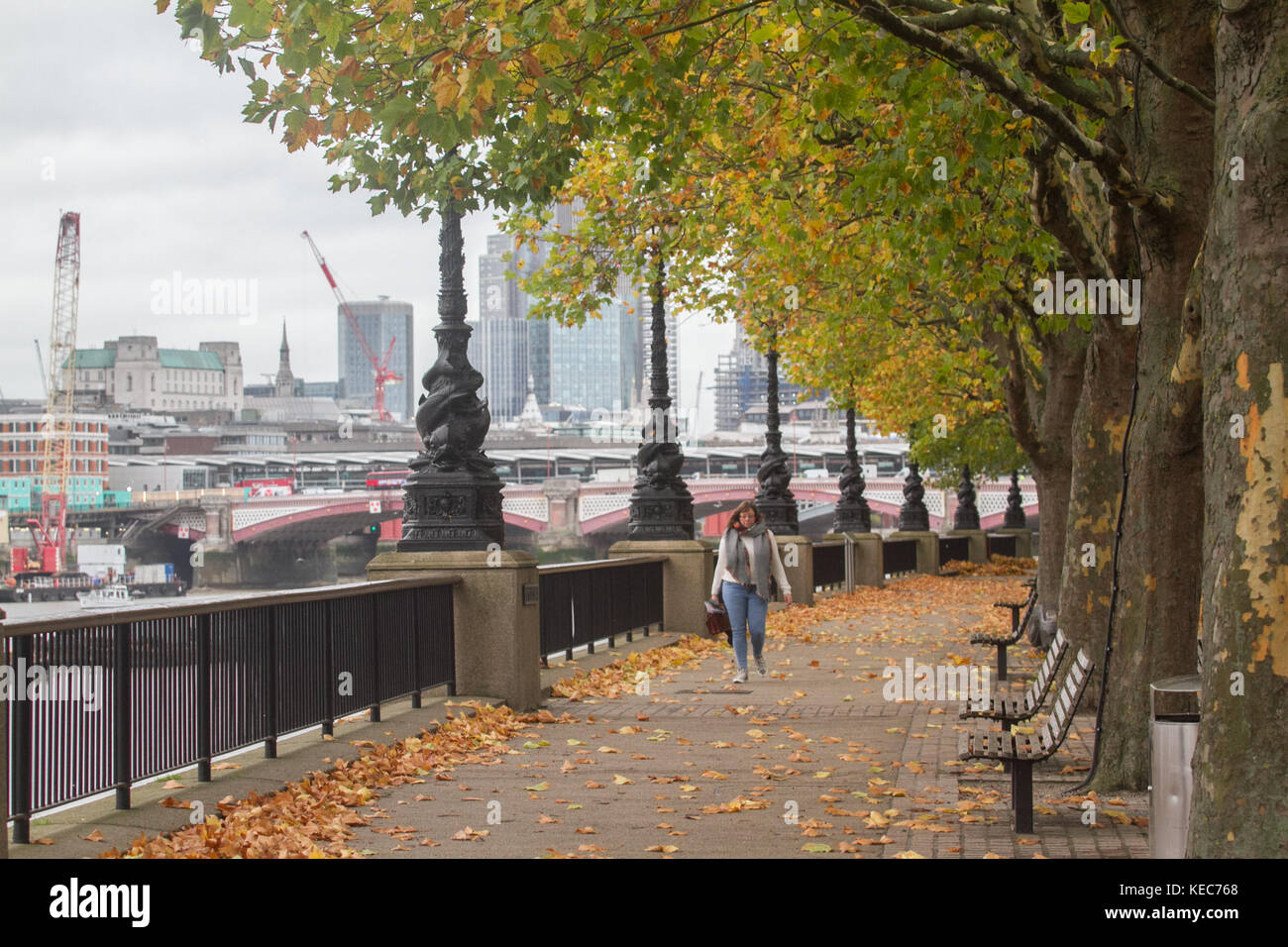 London, UK. 20th Oct, 2017. A woman strolls  on London South bank on a grey autumn day Credit: amer ghazzal/Alamy Live News Stock Photo