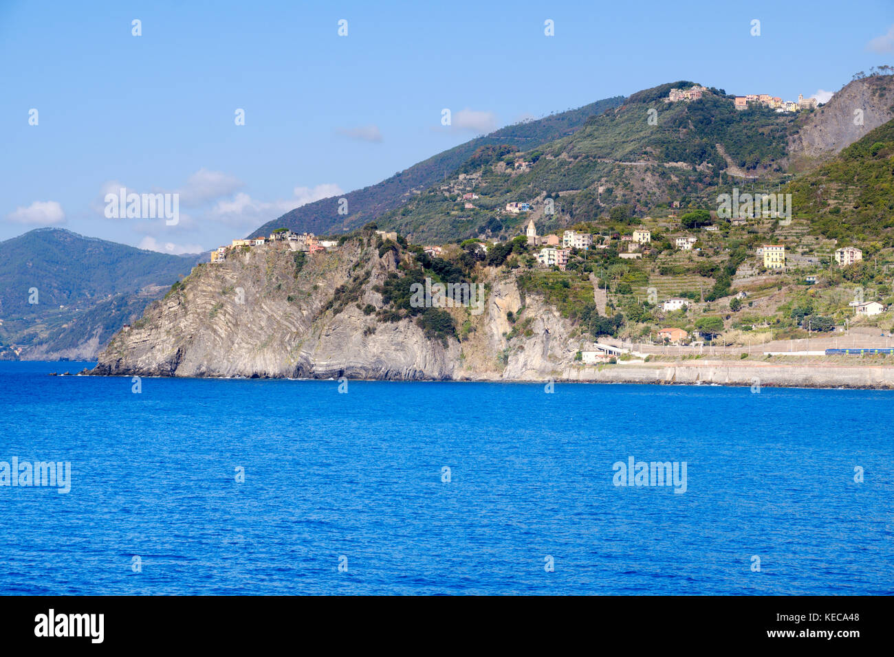 view of the Cinque Terre coastline with town of Corniglia from Manarola, Cinque Terre, Liguria, Italy Stock Photo