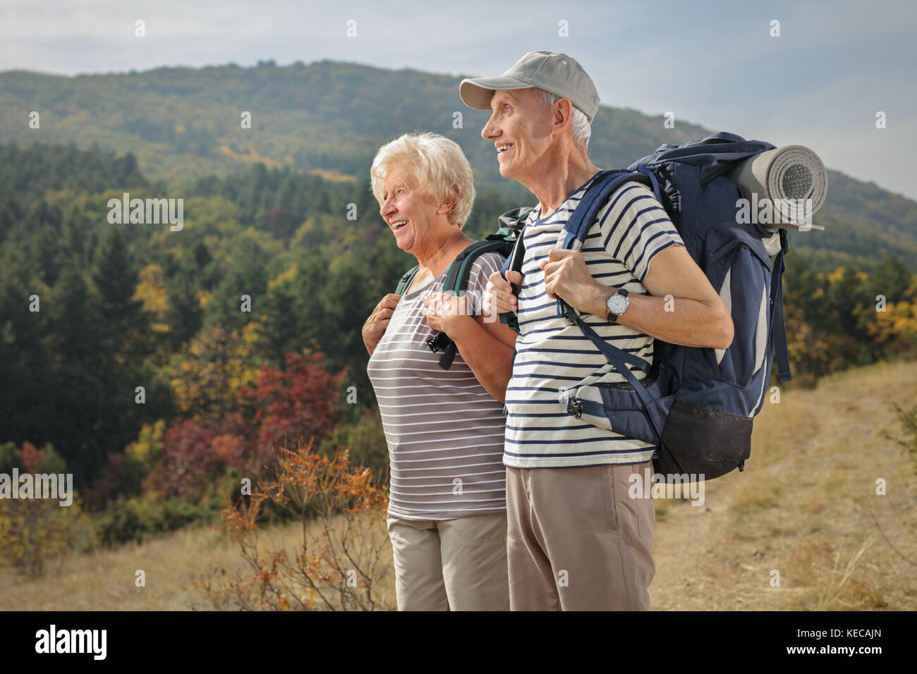 Two elderly hikers looking away outdoors Stock Photo
