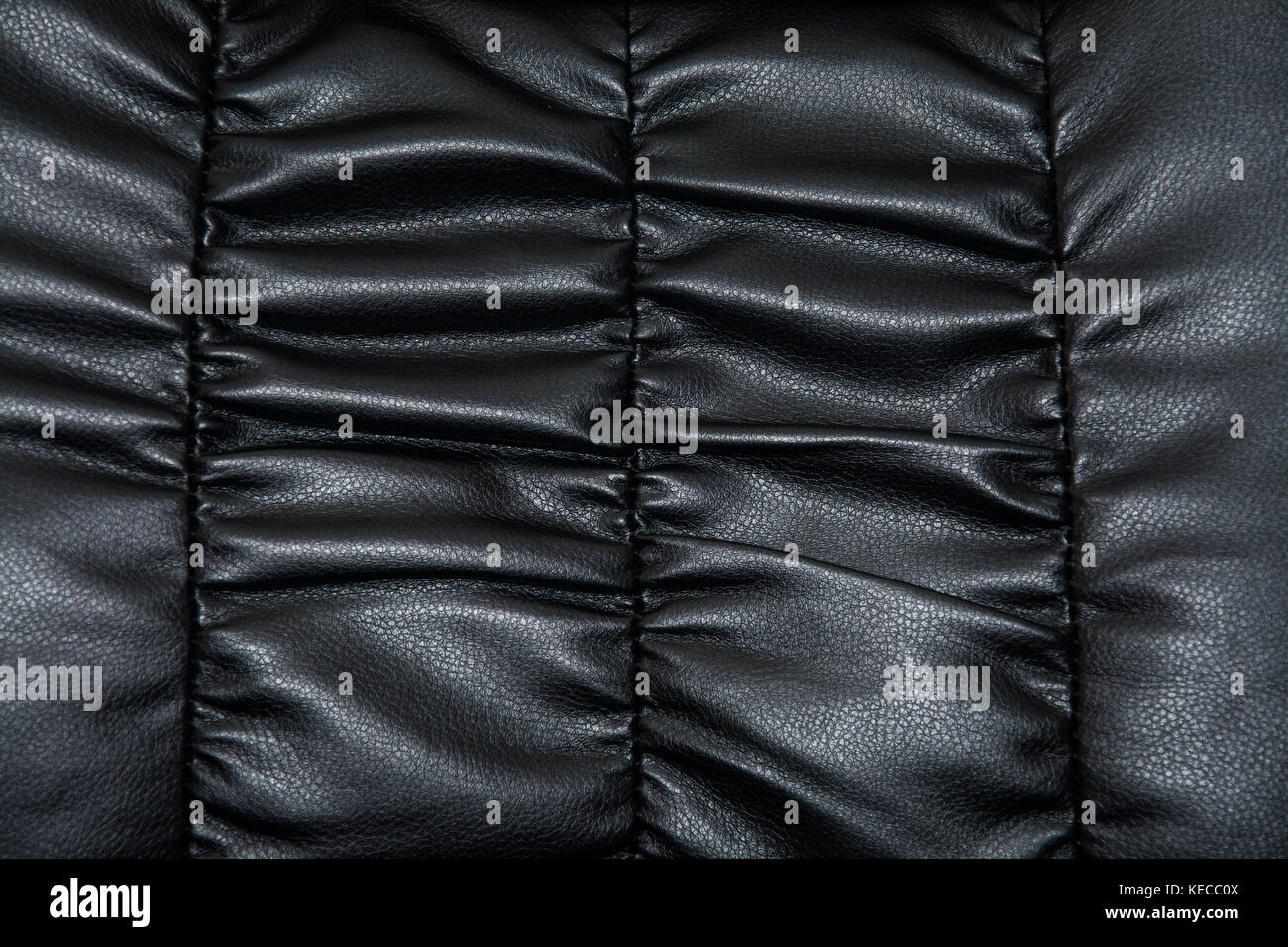 Close up of black Turin leather on an executive office chair. Would