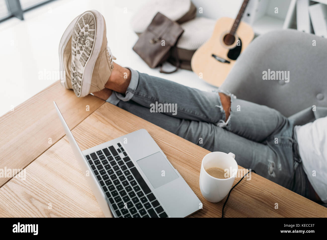 man relaxing at workplace Stock Photo