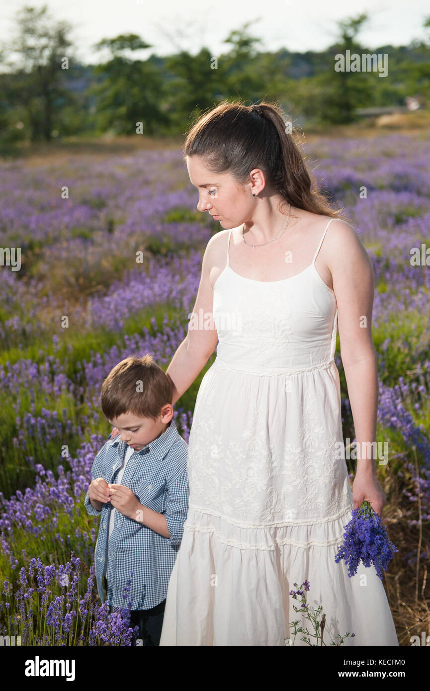 caring beautiful mother holding flower bouquet embracing thoughtful