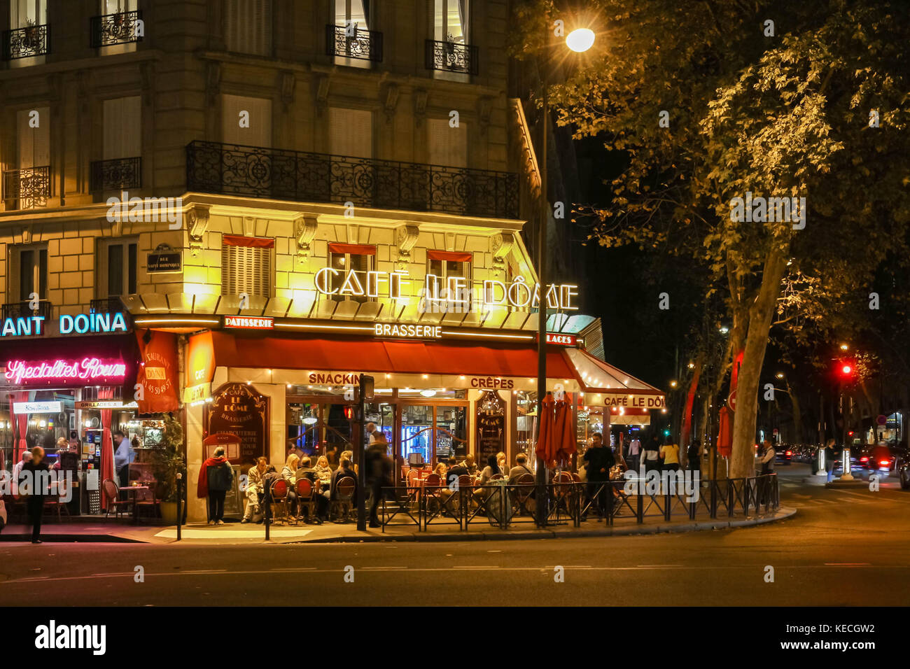 Le Dome night view, a traditonal French cafe located near the Eiffel tower in Paris, France. Stock Photo