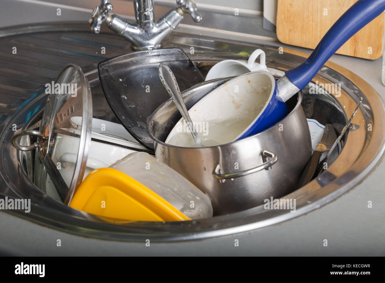 Pile of dirty dishes in the kitchen sink Stock Photo