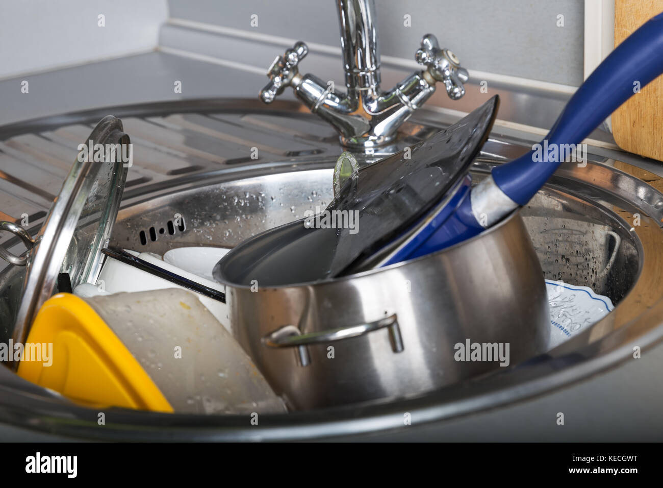 Dirty dishes in the kitchen sink Stock Photo