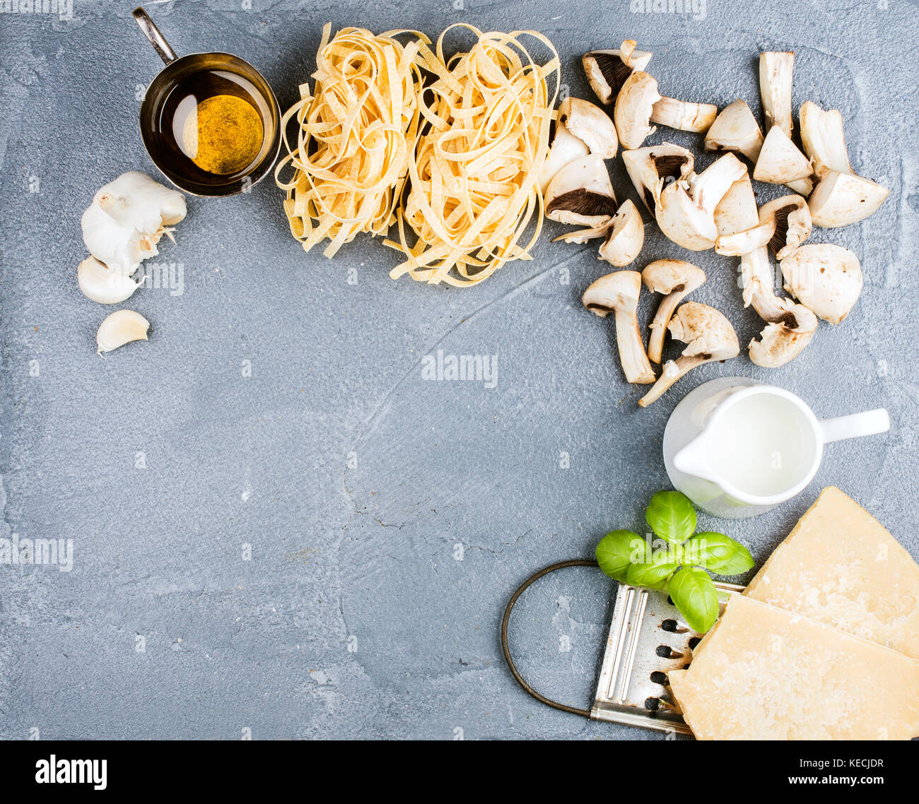 Ingredients for cooking pasta with mushrooms and white sauce Stock Photo