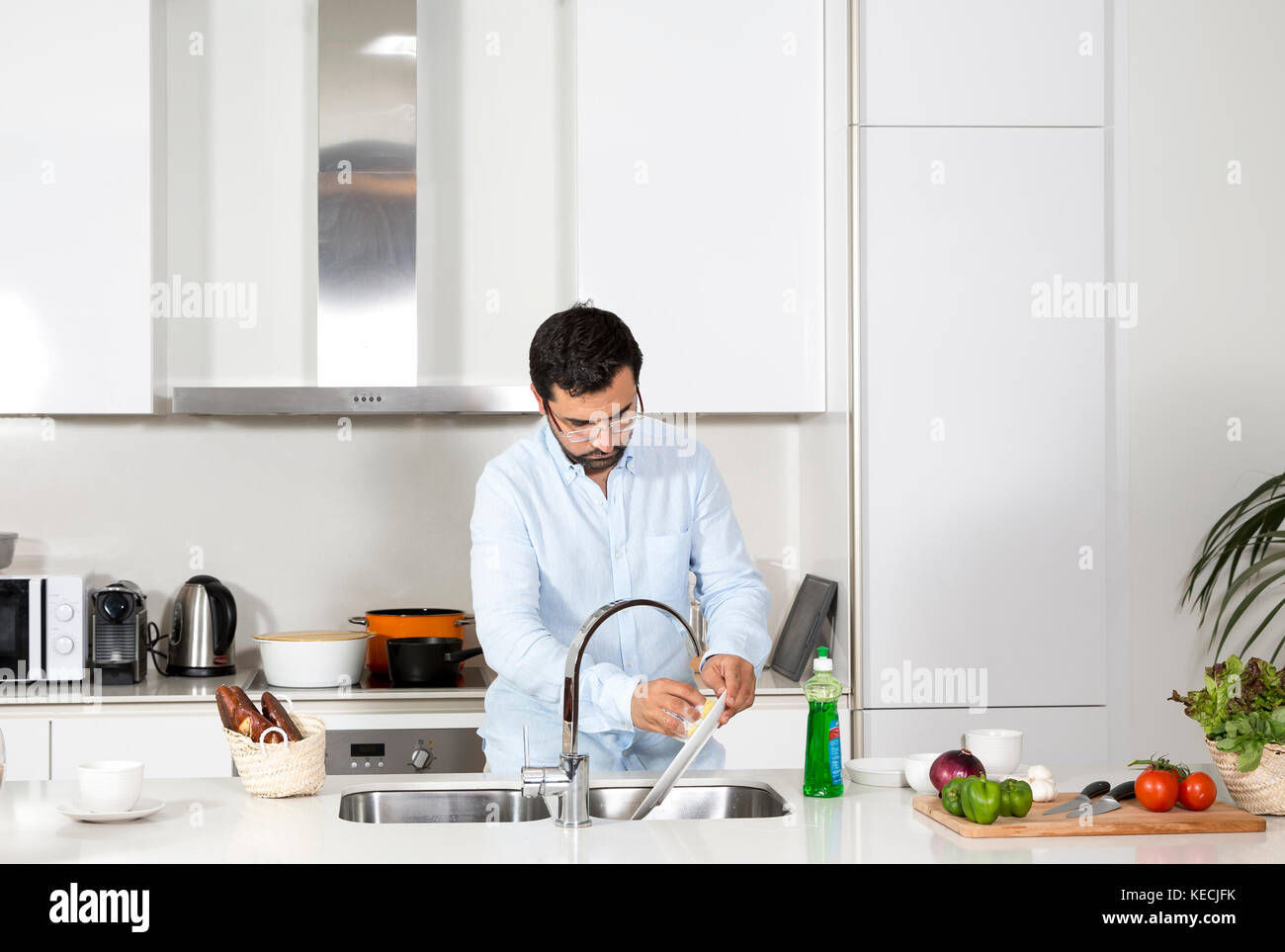 Man washing dishes Stock Photo - Alamy