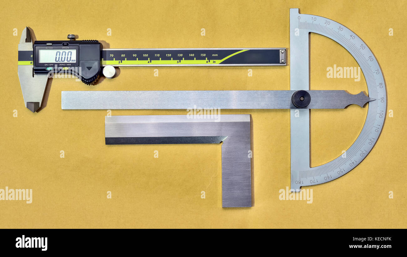 Digital caliper and protractor on paper industrial Stock Photo Alamy