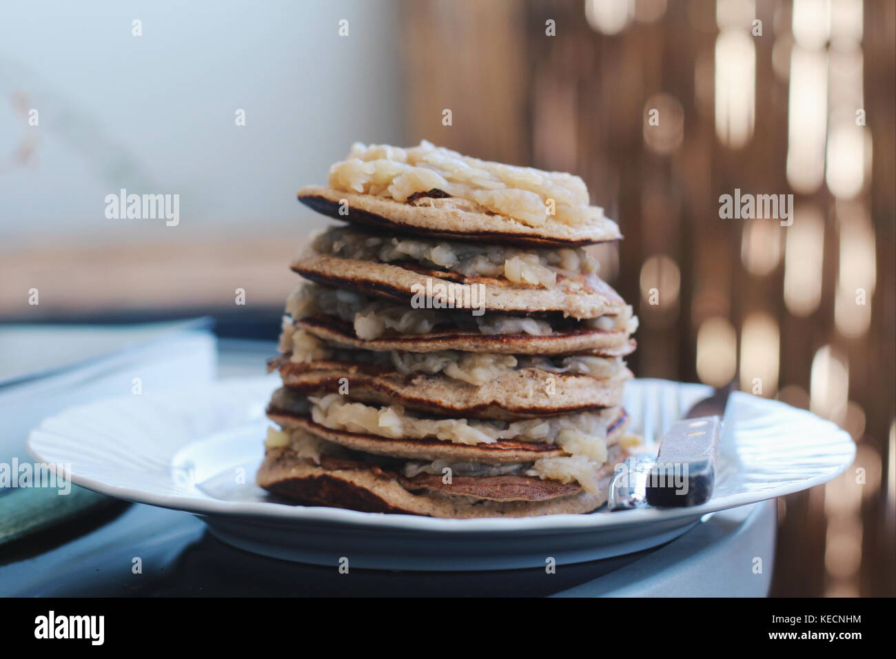 Homemade healthy pancakes, fresh from  the pan, filled with apple sauce. Delicious and great for breakfast or dessert. Stock Photo